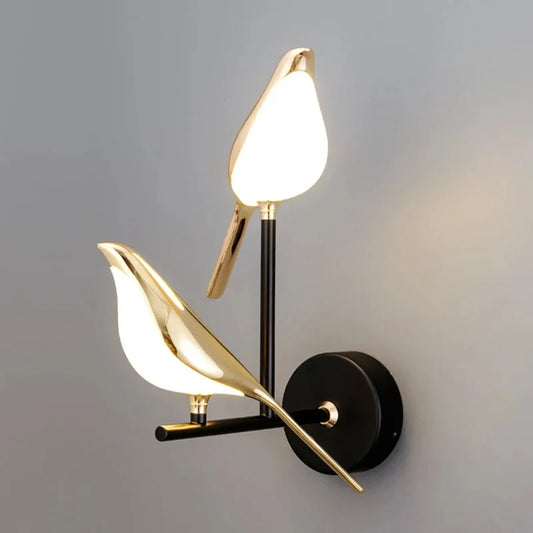 Golden birds wall lamp with warm LED light creating elegant ambient lighting