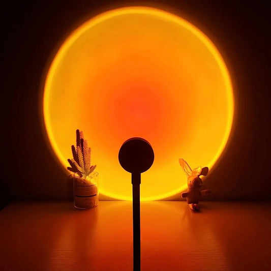 Sunset projection lamp casting warm golden circle light on wall
